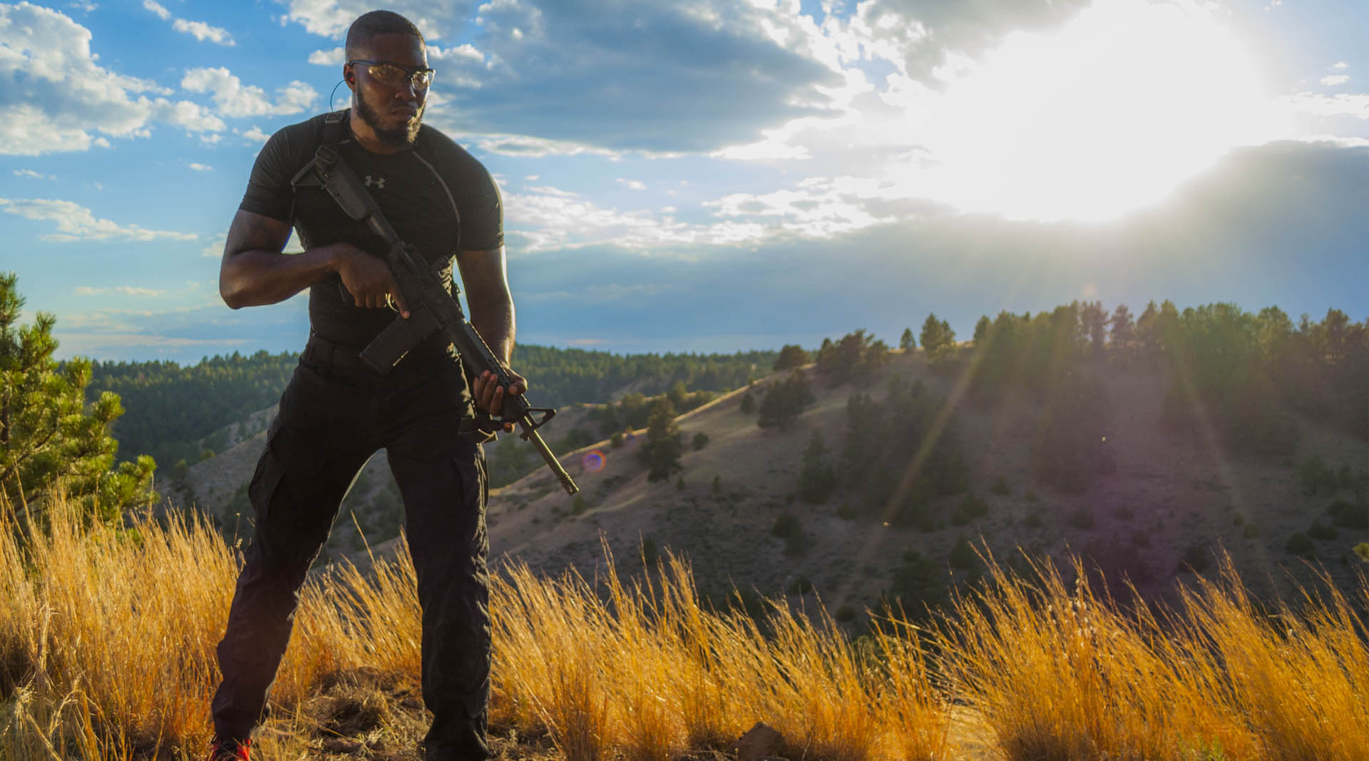 Edward J Ned Jr poised on a Wyoming hilltop with his Springfield Armory AR15