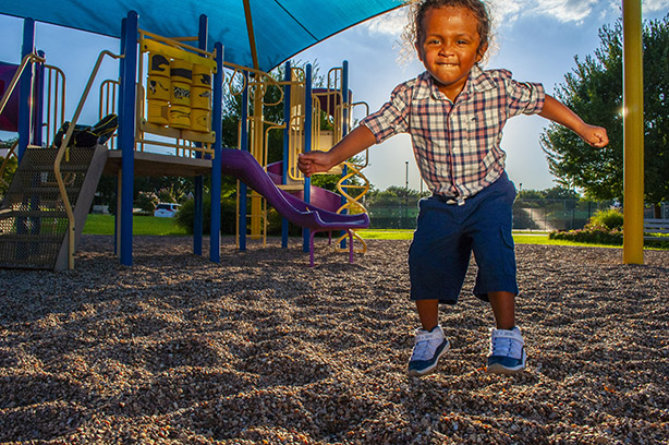 lifestyle photography neighborhood child on playground